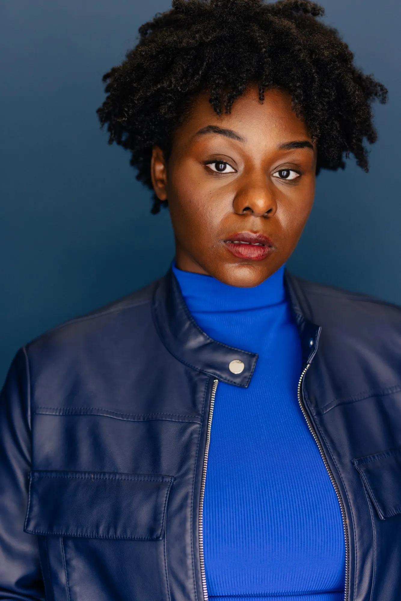 Abigail in a navy leather jacket